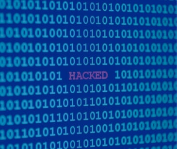 Hacked graphic with ones and zeros