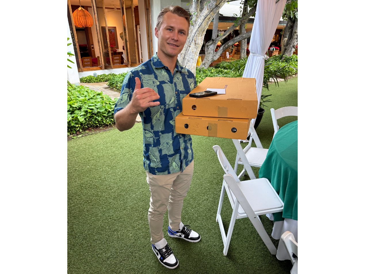 Mountan Mitchell (Account Executive, Paubox) rockin' the Paubox Jordan 1s and bringing the choice lei for our scholarship recipients