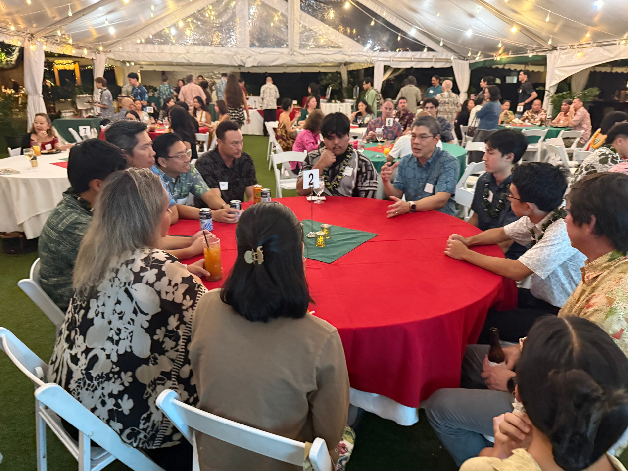 Eddie Fan (Director, Customer Systems, Apple) makes a point at Table 2 during structured&nbsp;networking | 2025 Paubox Kahikina Scholarship winter networking event