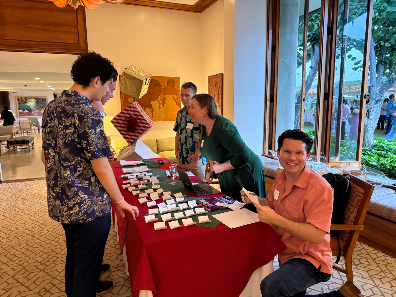 Michael Bennett (seated), founder of Honolulu Tech Week, came early to help out