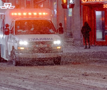 Image of an ambulance in the snow. 