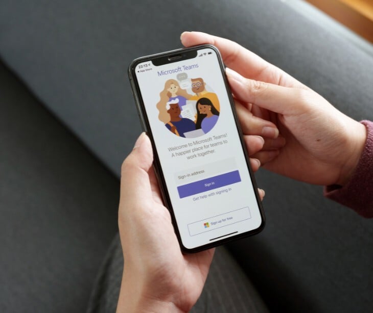 Image of a person with Microsoft Teams open on their phone. 