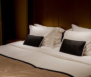 Image of a hotel bed. 
