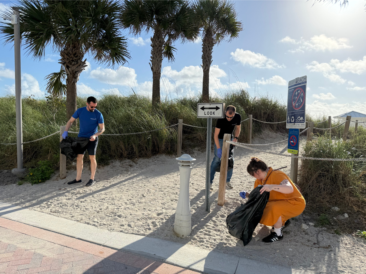 Left to right: Will Ashe, Don Beesing, and Aja Anderson getting started on the Miami Beach Boardwalk.
