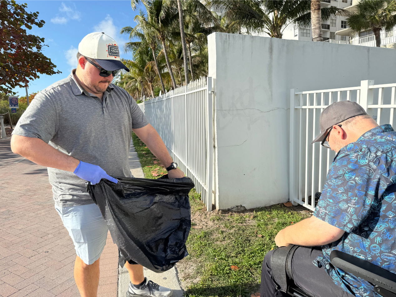 Milton Andrade (left) assisting Dan Dorszynski (right) with a litter deposit.