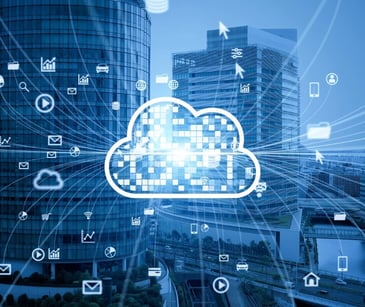 Image of a cloud emoticon with a background of a city. 