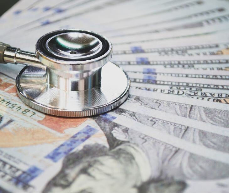 stethoscope on money
