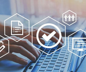 Image of someone typing on a computer with a check mark over it. 