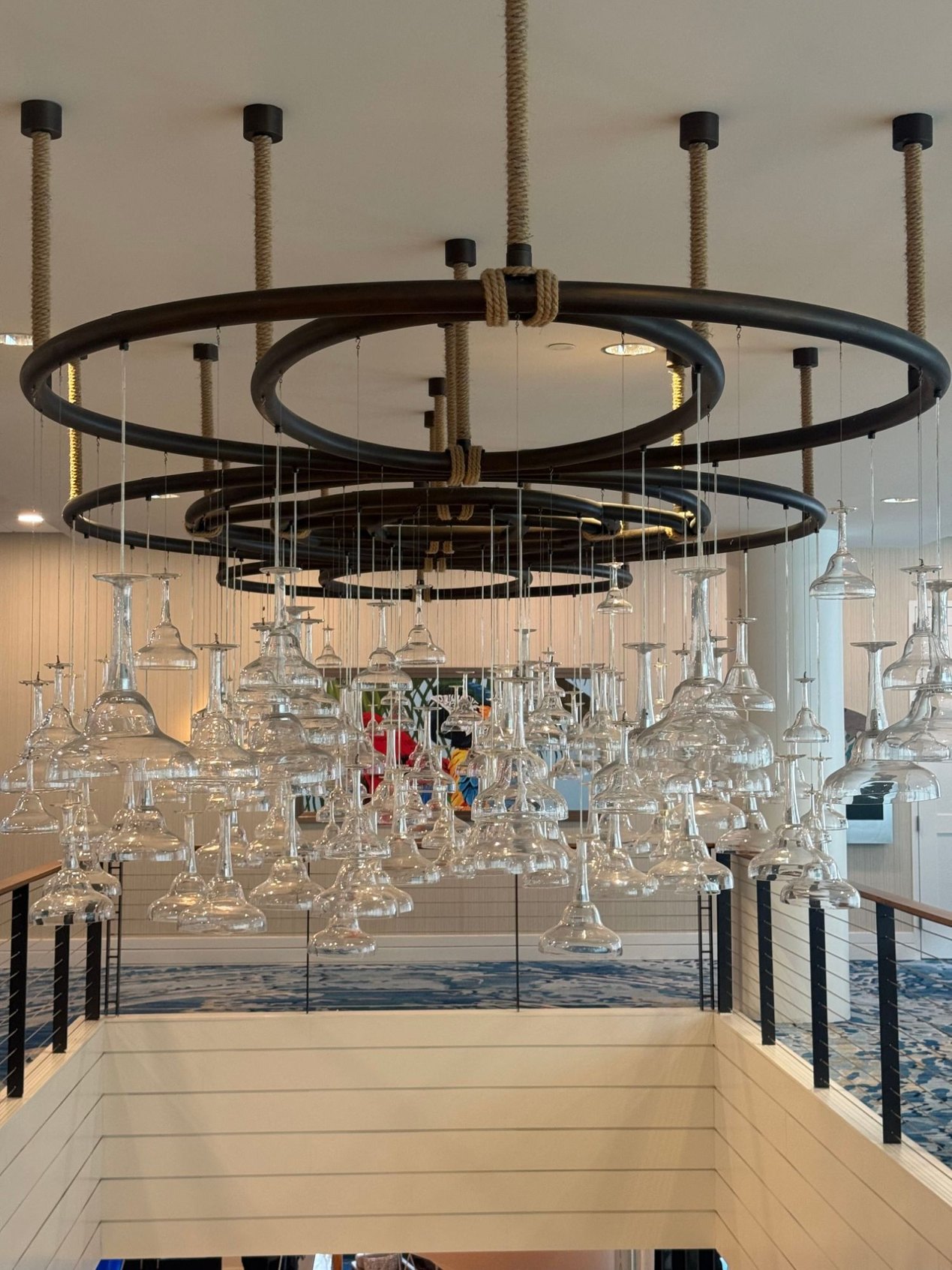 Chandelier of hanging margarita glasses on black iron rings wrapped in rope | DSO Tech Summit and The Paubox Table in Nashville