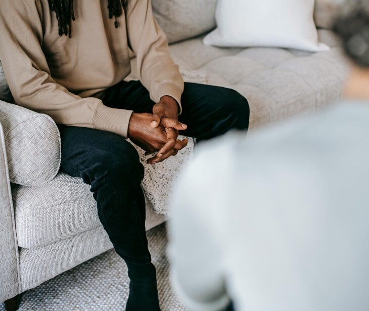 Image of a therapist talking to a client. 
