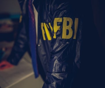 Image of someone in an FBI jacket. 