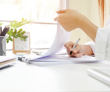 Image of someone looking at papers.