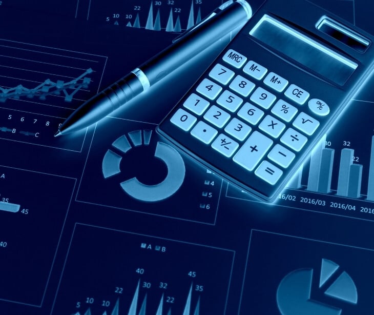 Image of a calculator and pen. 