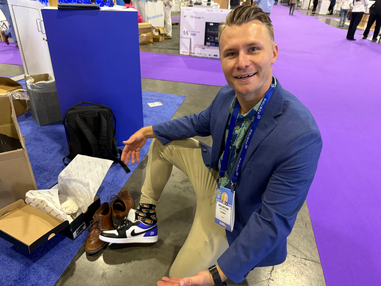 Mountan Mitchell trying on the Paubox Jordan Ones on the conference floor | HLTH USA 2025 Day 1: My Takeaways