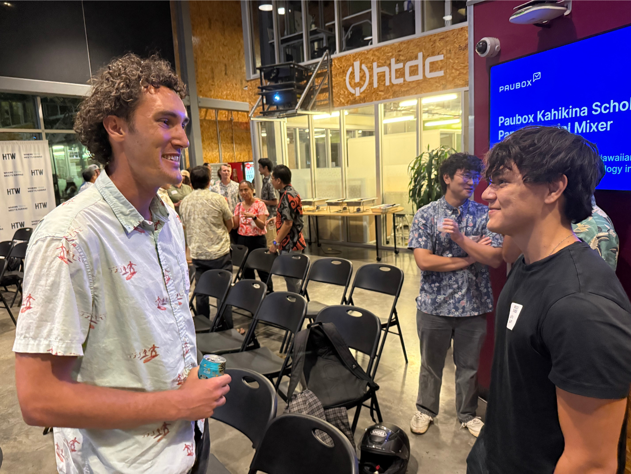 Paubox Kahikina Scholarship recipient Kawika Naweli (right) networking with an attendee | Honolulu Tech Week 2025: Paubox Kahikina Scholarship Panel