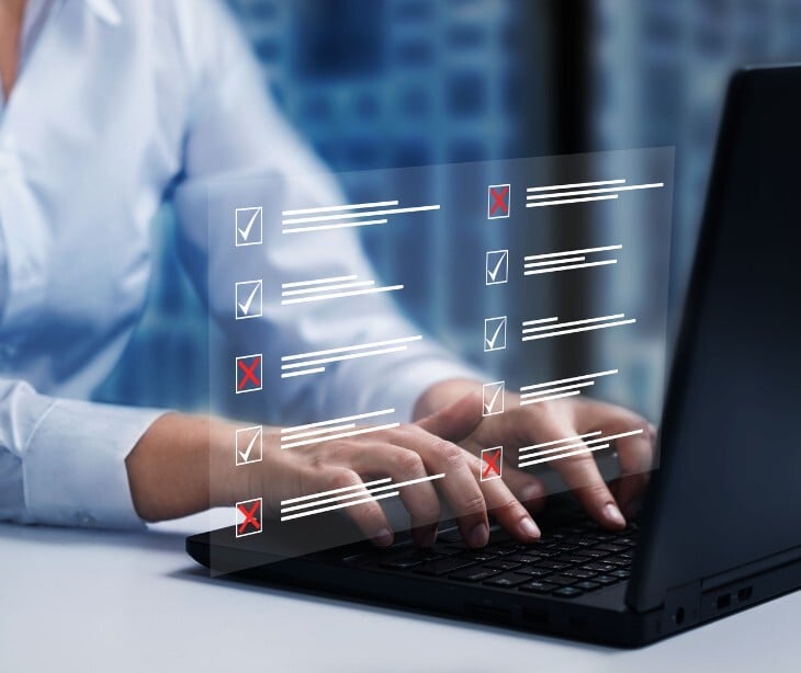 Image of someone typing on a laptop. 