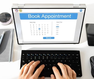 laptop with online booking program