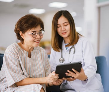 doctor and patient with tablet