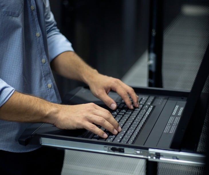 Image of someone typing on a laptop. 