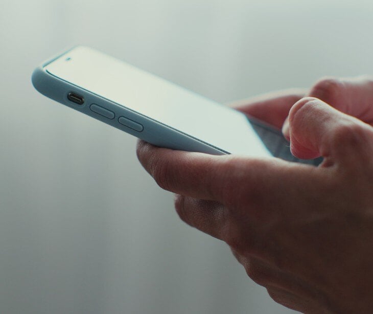 hands holding smartphone