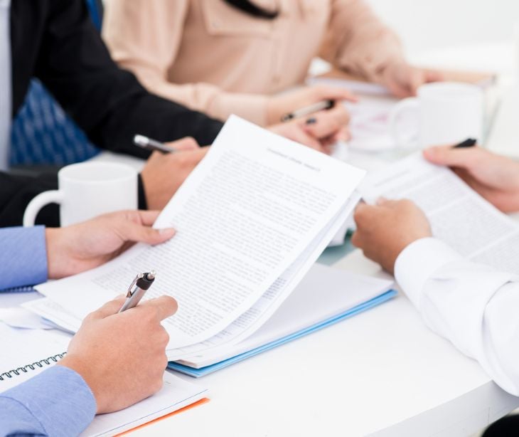 hands with paperwork