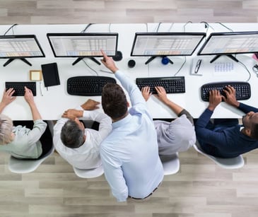 employees at a computer station