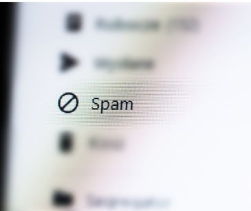 computer email inbox with the word spam highlighted