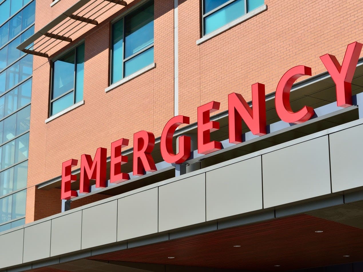 Emergency hospital building where ambulances escort patients