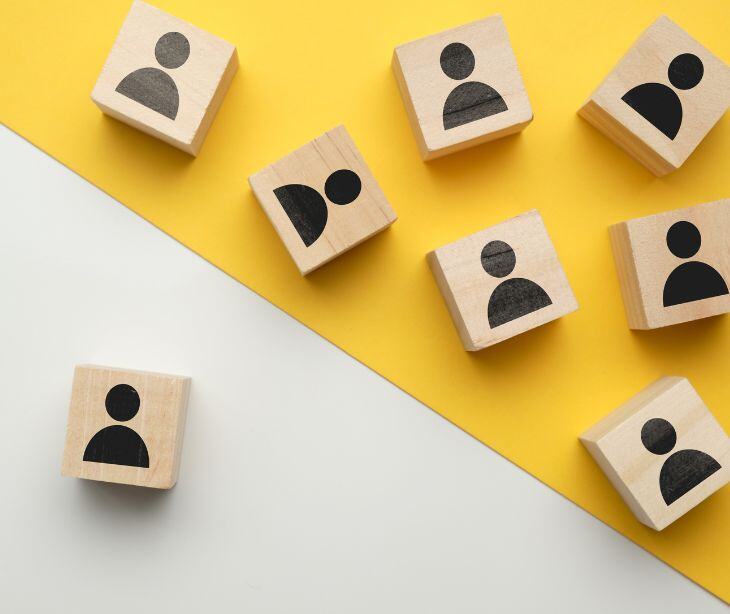 people icons on wooden blocks