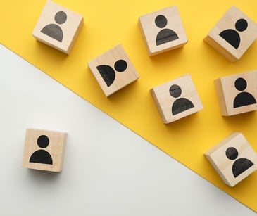 people icons on wooden blocks