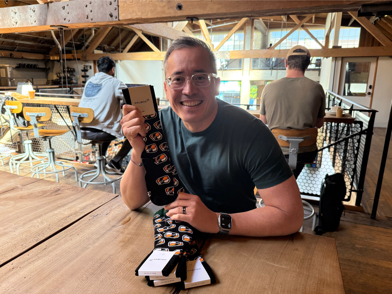 Loading up Eric Nakagawa with five pairs of Pausox for his family | Keep building, no matter what: coffee w/ Eric Nakagawa & Miki Hardisty