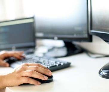 Image of someone typing on a keyboard. 