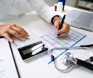 Image of someone working on medical coding. 