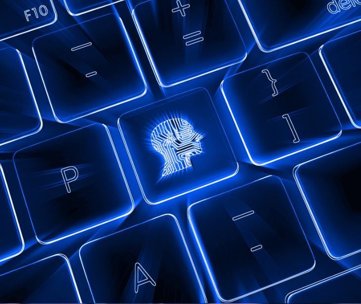 digital blue head on computer keyboard