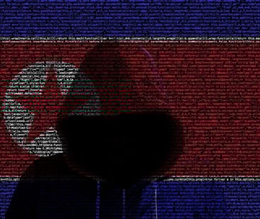hacker with North Korean flag