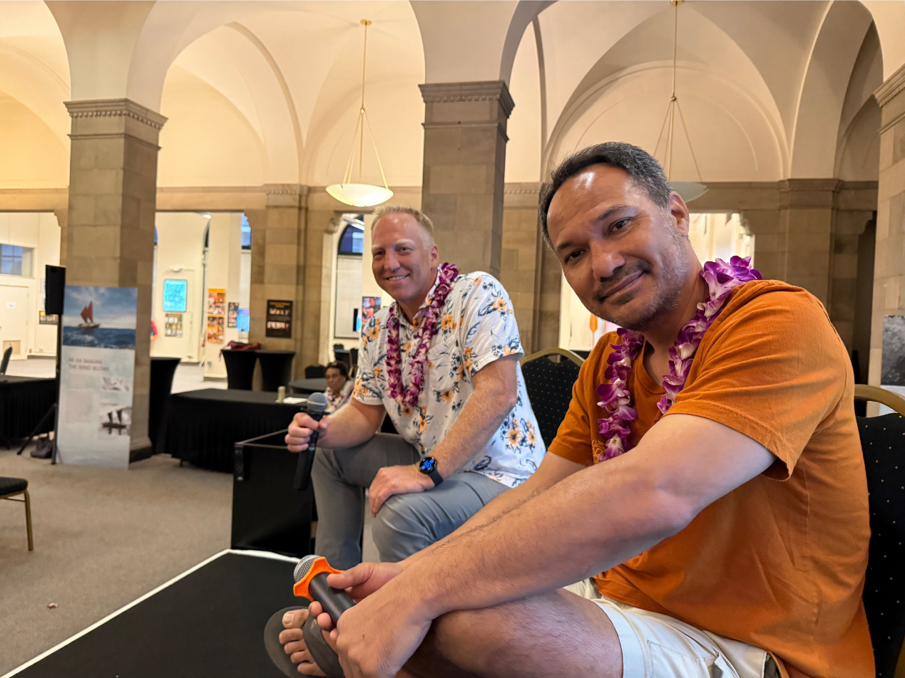 A view from the stage: Matt Bottomly and Olin Lagon. Note Olin's power move, wearing slippahs on a patent panel. I loved it | Patent Your Invention - Hawaii Tech Week 2026