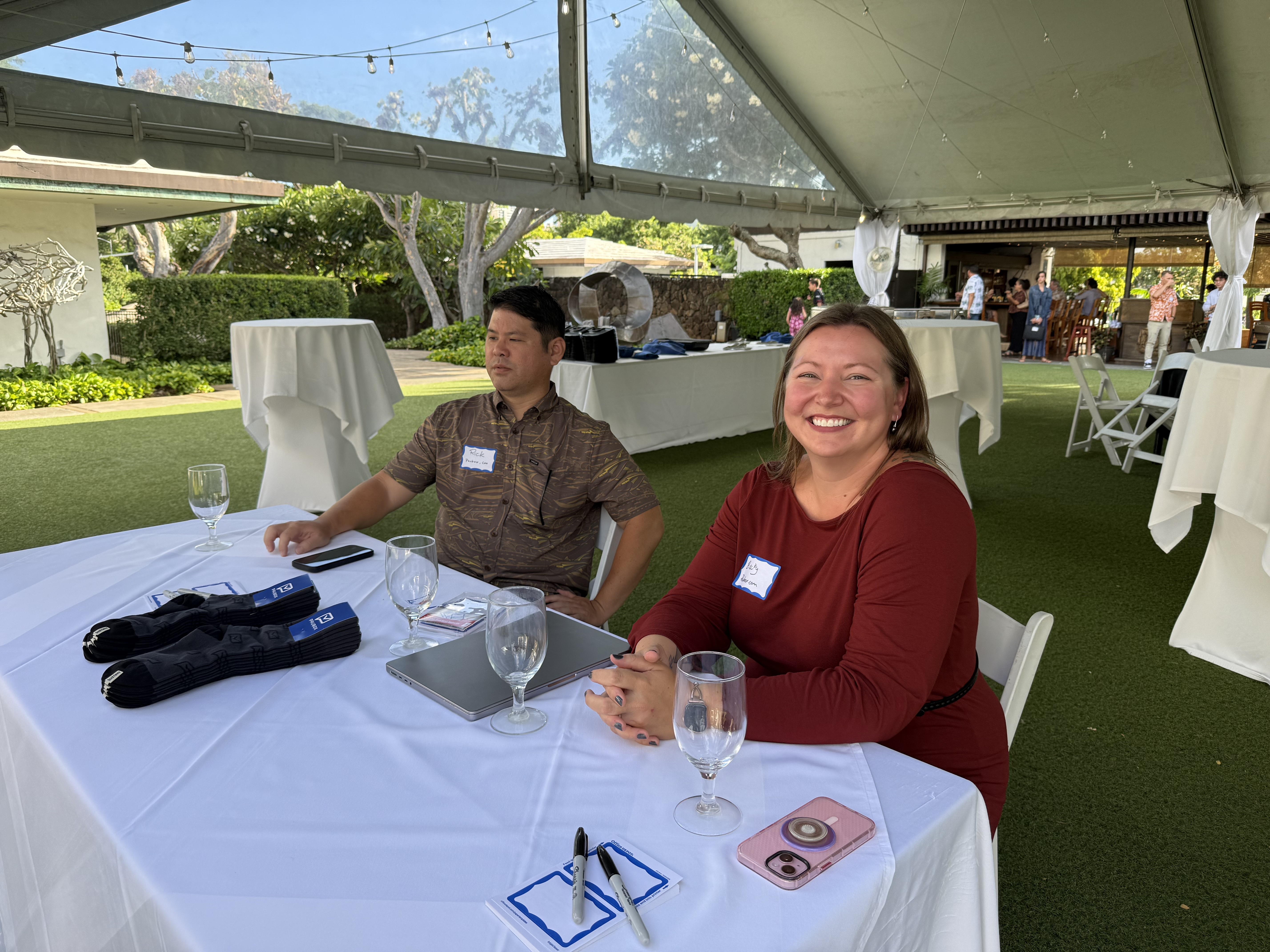 Rick Kuwahara (COO, Paubox) and Becky Hathaway (VP of People Operations, Paubox at the check-in table | Paubox Social Mixer in Honolulu