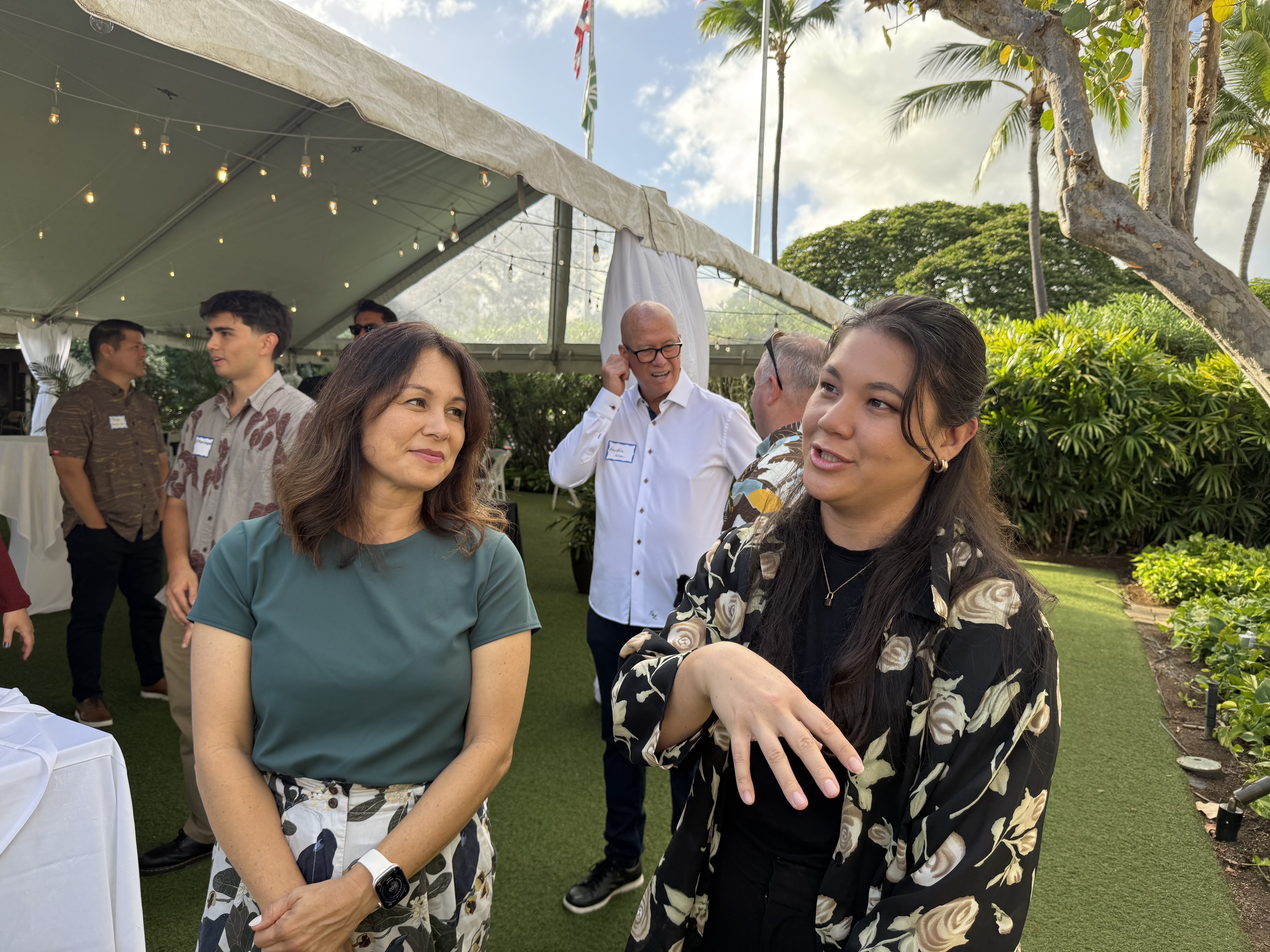 Darcie Yukimura (Director of Programs, Kosasa Foundation) listens as Nalani Kaku (Hawaii Technology Pathways (HTP) at Recurring Decimal) gives an overview of HTP and its mission to build sustainable technology career pathways that connect kamaʻāina professionals back to Hawaiʻi.