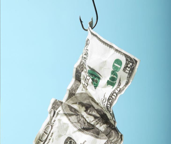 money bill on fish hook