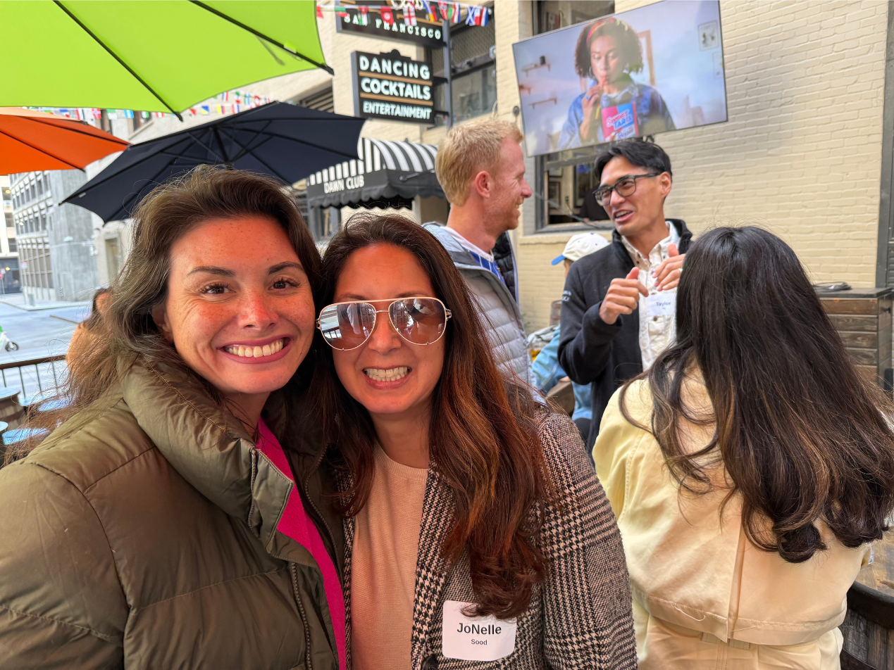 Tianna Johnson (Founder, People Culture Talent) and JoNelle Sood (Founder & President, Hoʻomau Foundation) reconnecting over a World Cup match.