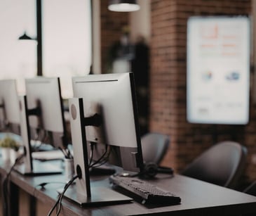 Image of several desktop computers. 