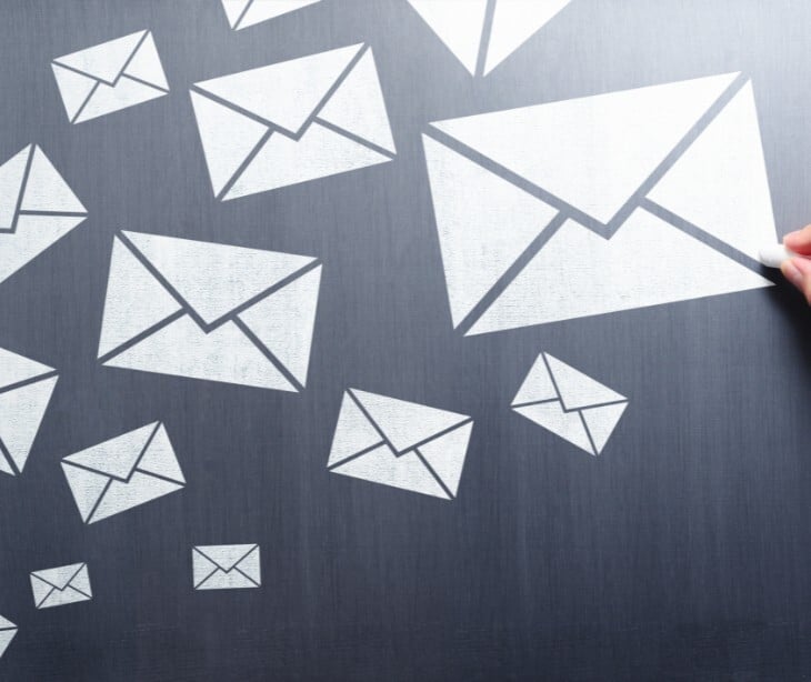 Image of email icons on a blackboard. 