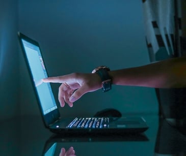 Image of someone on a laptop. 