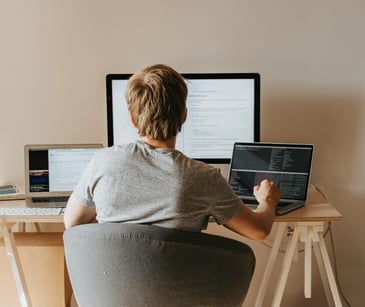 Image of a teen boy on a computer. 