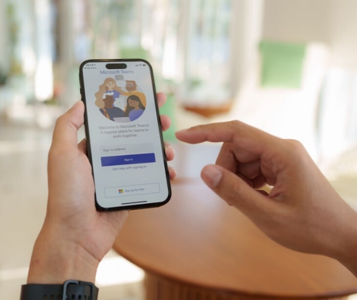 Image of someone on Teams on their phone. 