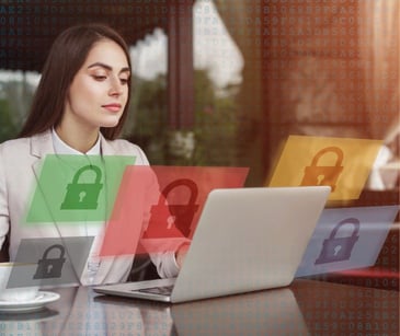 woman at a laptop surrounded by floating lock icons