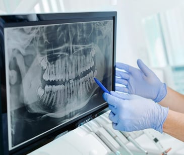 When is a dentist a business associate?
