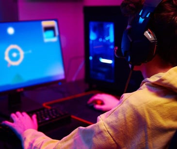 child gaming at computer for post Why HIPAA compliant email is best for educating parents on tech addiction
