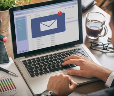 Image of someone opening an email. 