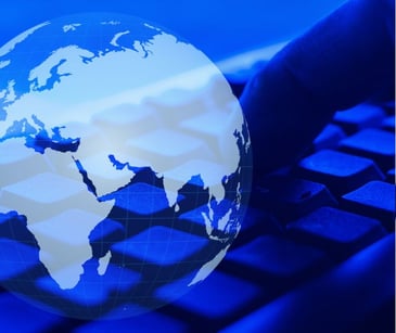 globe digital icon over computer keyboard